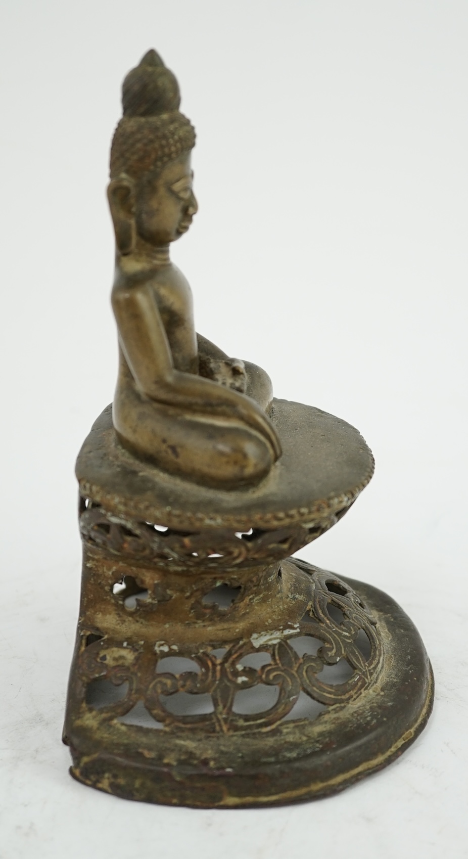 An unusual Burmese bronze seated figure of Buddha, 17th/18th century